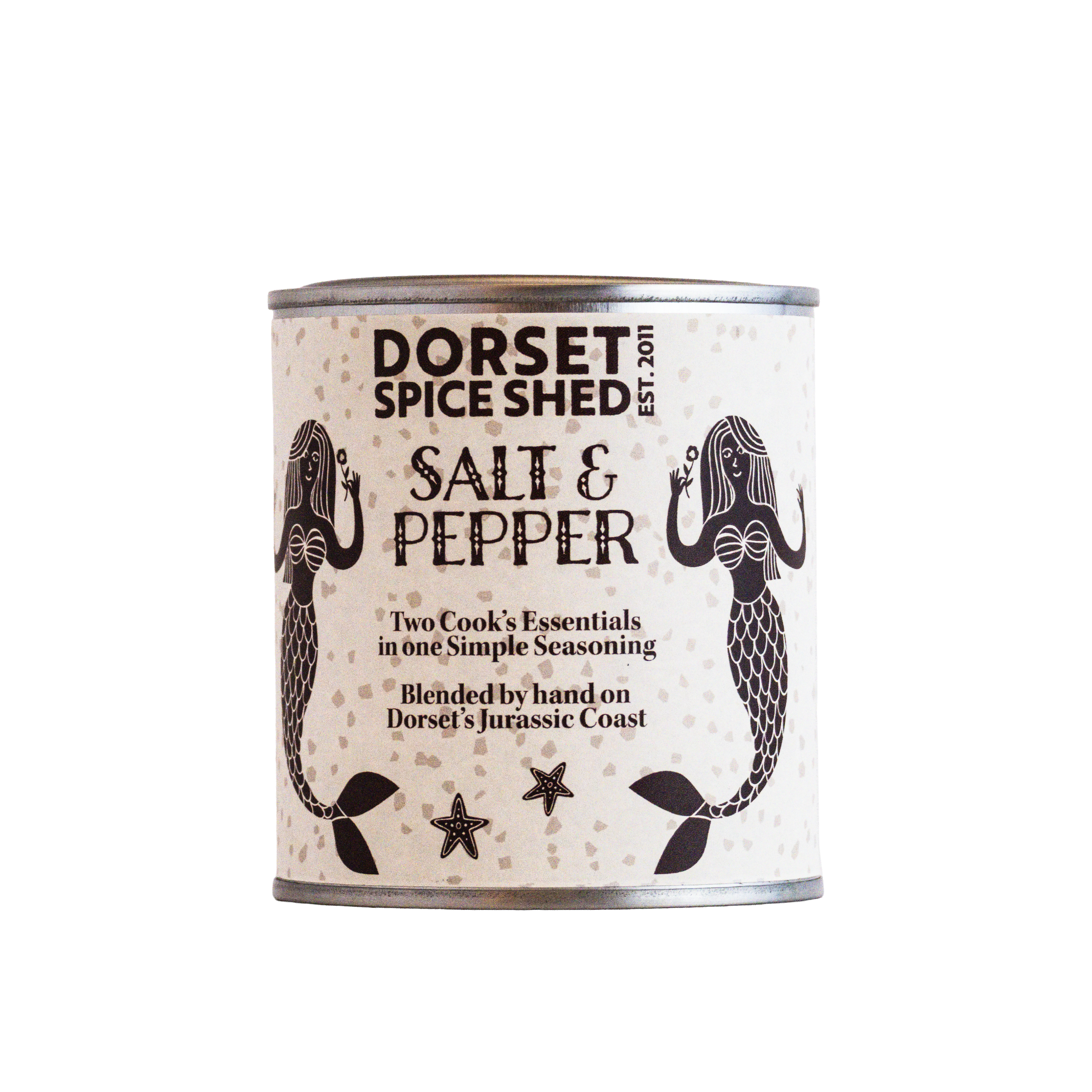 A can of Dorset Spice Shed Salt & Pepper seasoning on a plain white background. The label is cream-colored with black text and illustrations of mermaids and starfish.