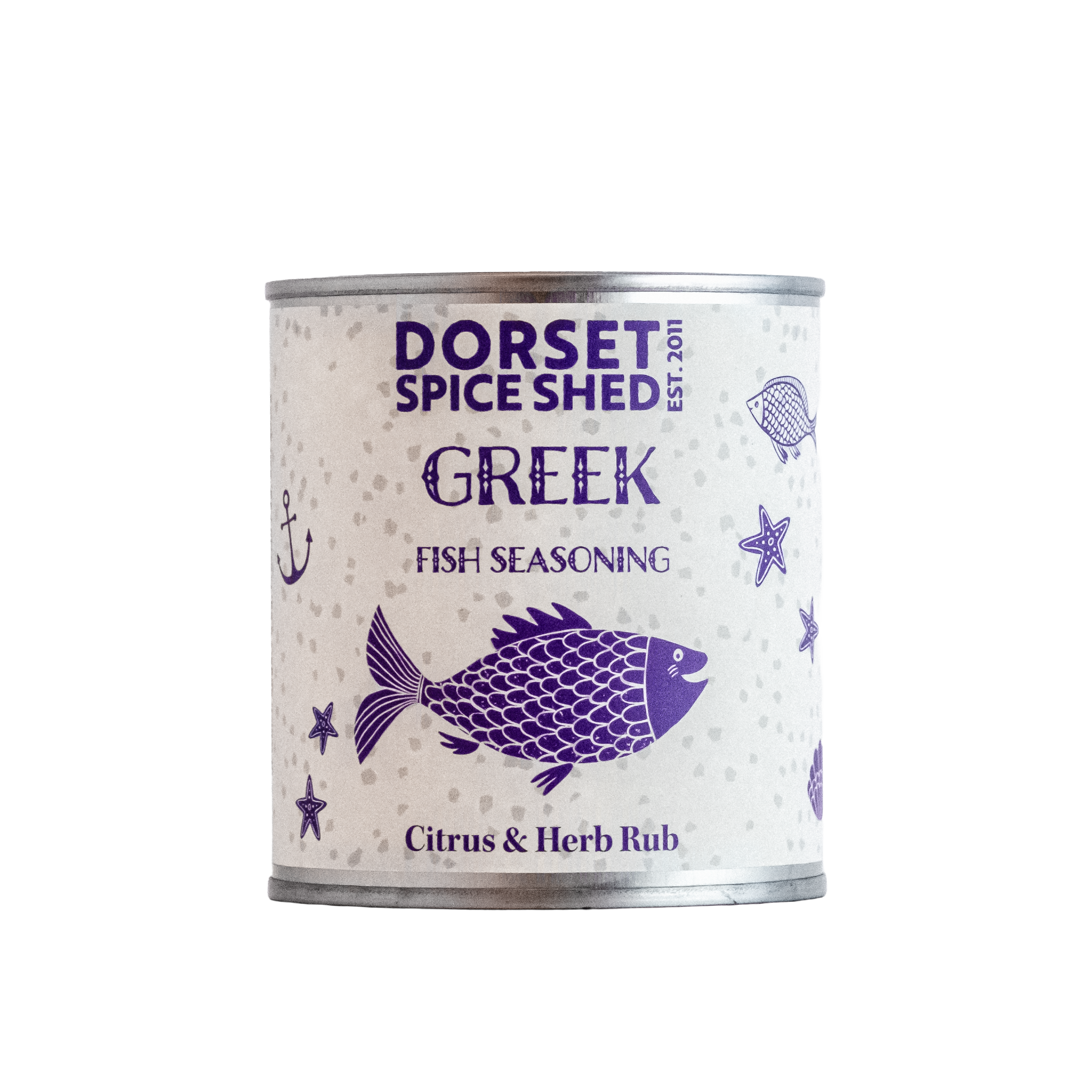 A cylindrical metal can of Dorset Spice Shed Greek Fish Seasoning, featuring a white label with purple illustrations of a fish, anchor, and starfish on a clean white background.